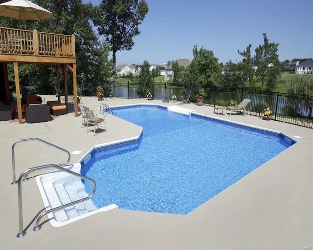 view of swimming pool with a patio area, an outdoor hangout area, and a wooden deck