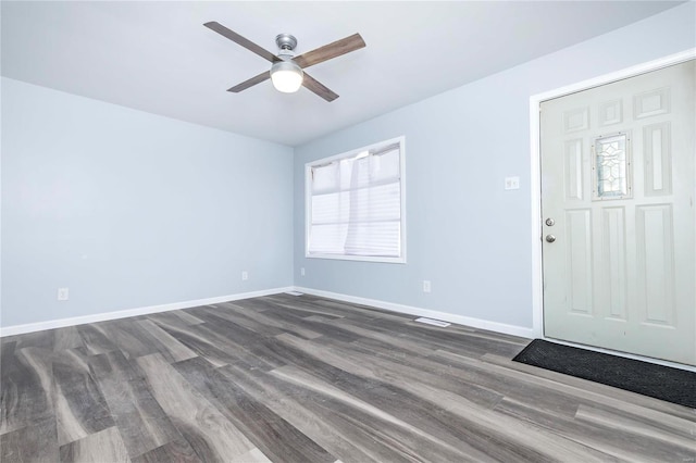 foyer entrance with ceiling fan and hardwood / wood-style floors