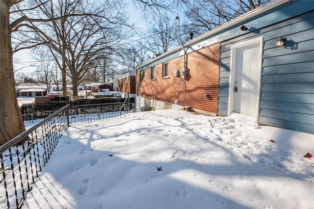 view of yard layered in snow