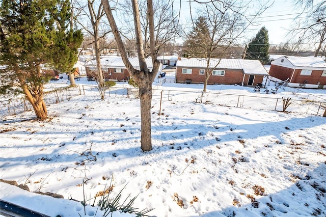 view of yard layered in snow