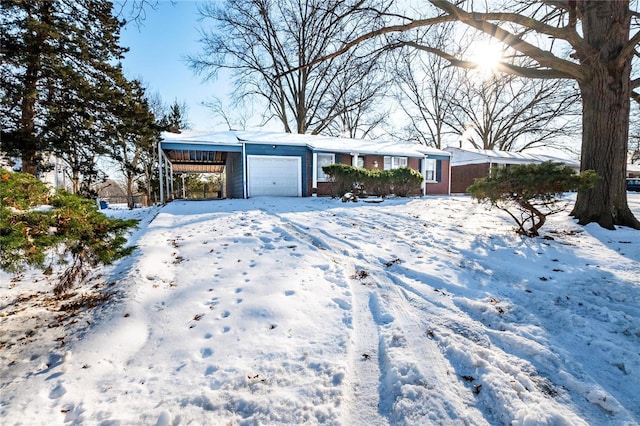 ranch-style house featuring a garage