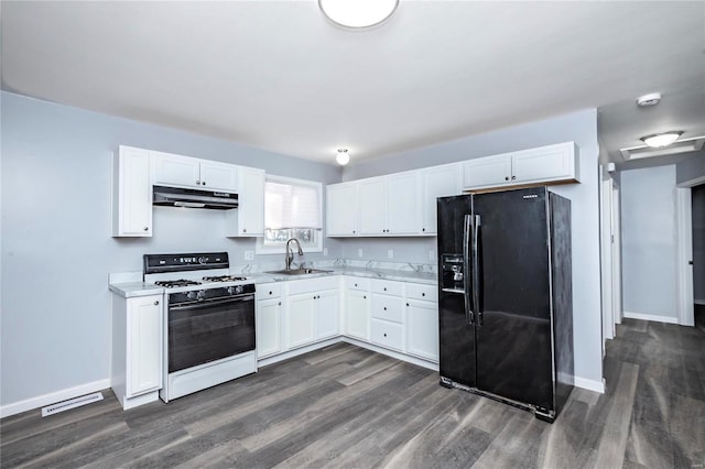 kitchen with dark wood-type flooring, black fridge with ice dispenser, white range with gas cooktop, white cabinetry, and sink