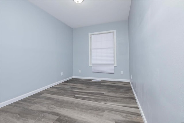 empty room featuring wood-type flooring