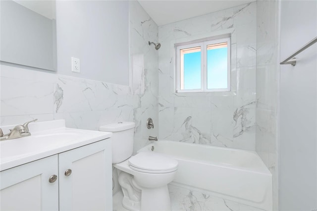 full bathroom with toilet, vanity, tile walls, and tiled shower / bath combo