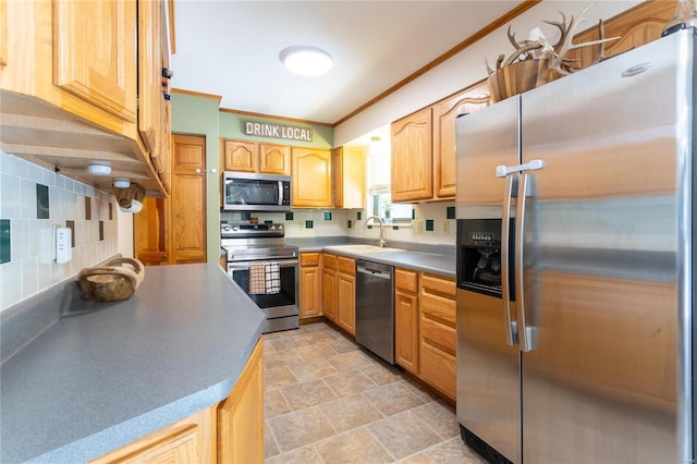 kitchen featuring decorative backsplash, appliances with stainless steel finishes, light brown cabinetry, ornamental molding, and sink