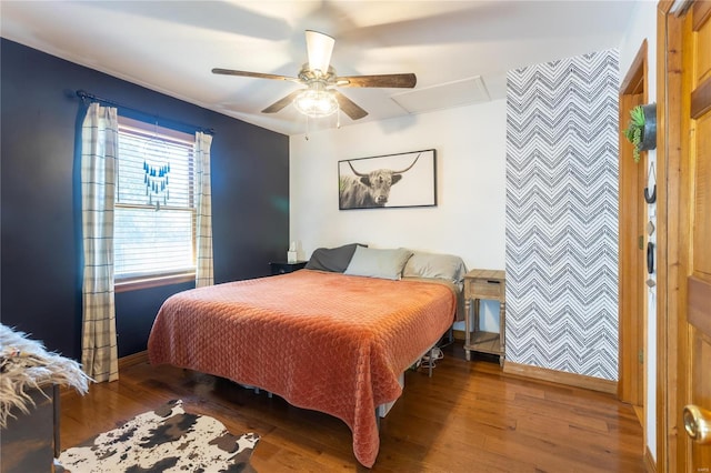 bedroom with hardwood / wood-style flooring and ceiling fan