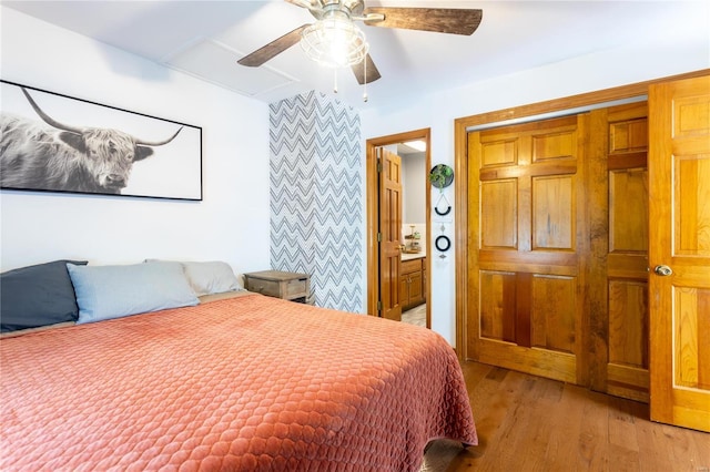 bedroom with ceiling fan and light hardwood / wood-style floors