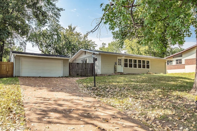 view of front of property with a front lawn and a garage