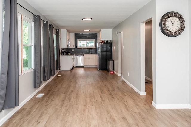 hall with sink and light hardwood / wood-style floors