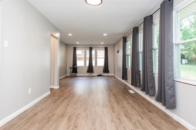 unfurnished room with light hardwood / wood-style flooring