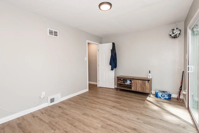 unfurnished room featuring hardwood / wood-style flooring