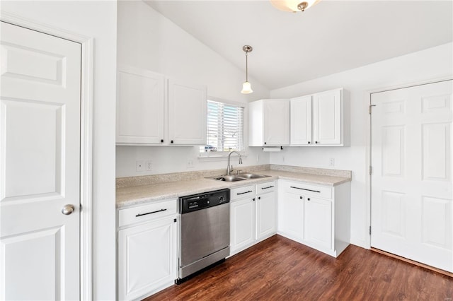 kitchen featuring stainless steel dishwasher, sink, white cabinets, hanging light fixtures, and lofted ceiling