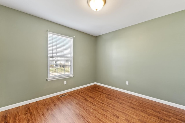 unfurnished room featuring wood-type flooring