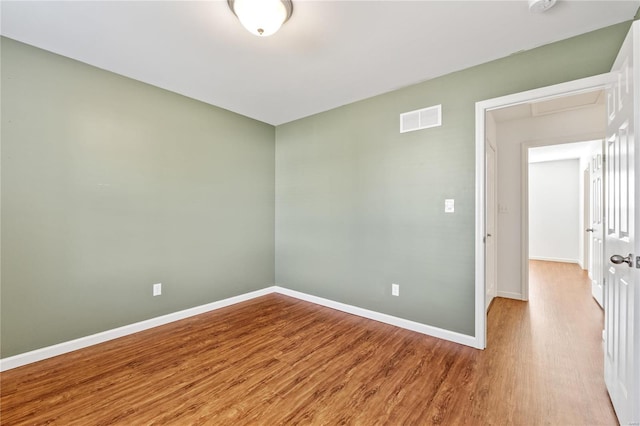 spare room with light hardwood / wood-style floors