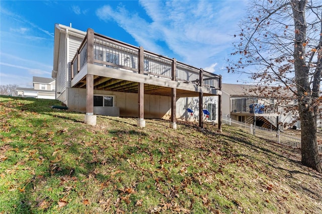 back of property featuring a deck