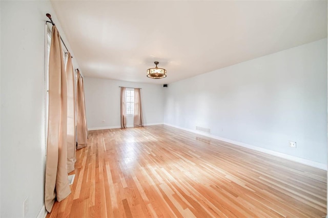 unfurnished room with light hardwood / wood-style flooring