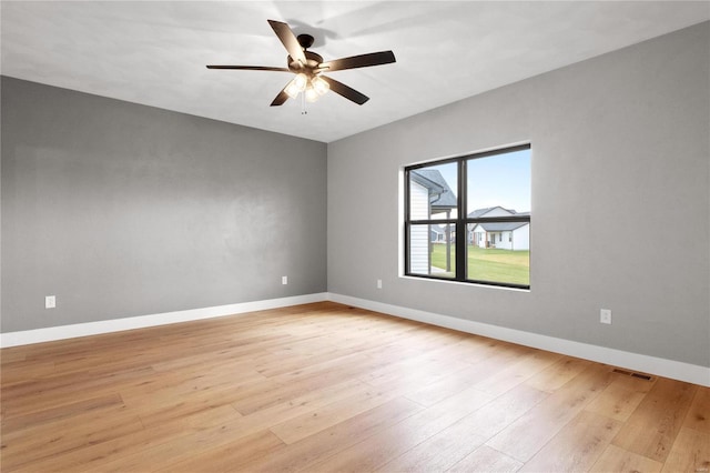 unfurnished room featuring light hardwood / wood-style flooring and ceiling fan