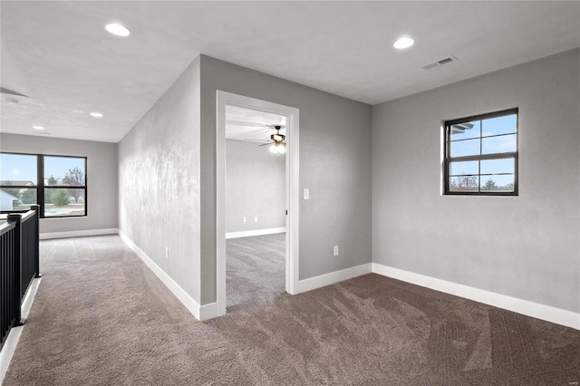 carpeted empty room with ceiling fan