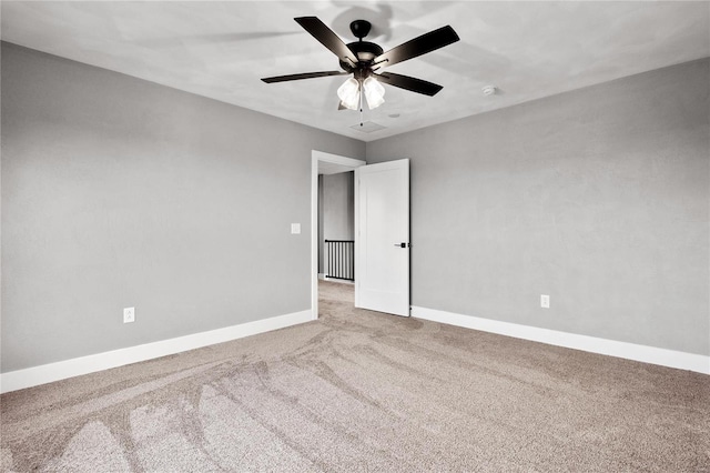 empty room with carpet and ceiling fan