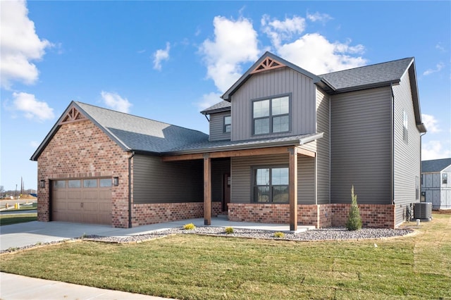 craftsman-style house featuring a garage, central AC, and a front yard