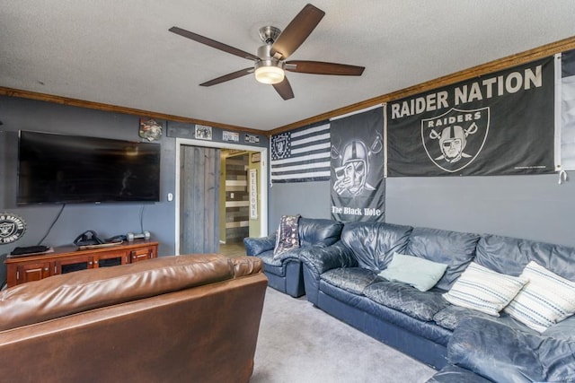 carpeted living room with ceiling fan, ornamental molding, and a textured ceiling