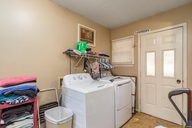 washroom with independent washer and dryer