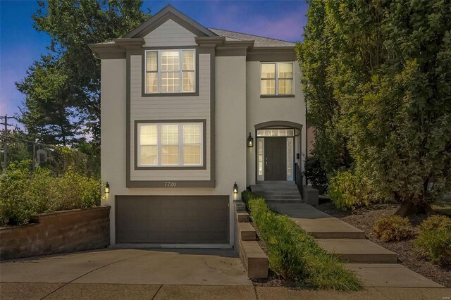 view of front of property with a garage