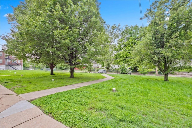 view of property's community featuring a yard