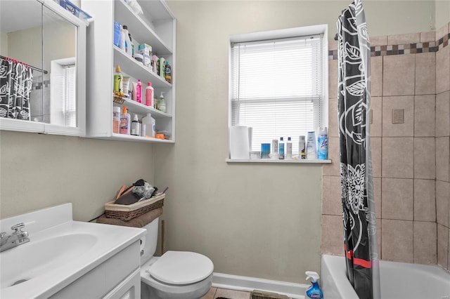 full bathroom featuring shower / bath combo with shower curtain, vanity, and toilet