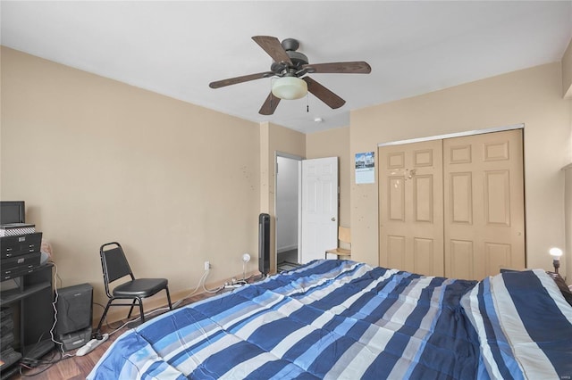 bedroom featuring hardwood / wood-style flooring, a closet, and ceiling fan