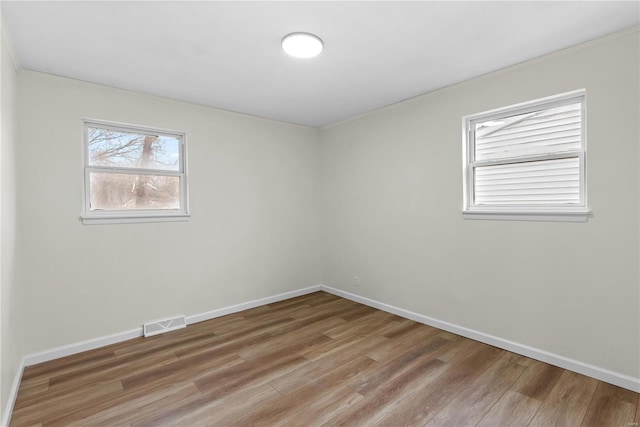 unfurnished room featuring wood-type flooring