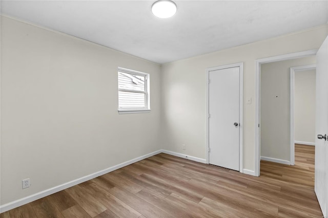 spare room with light hardwood / wood-style floors