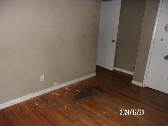 spare room featuring dark hardwood / wood-style flooring