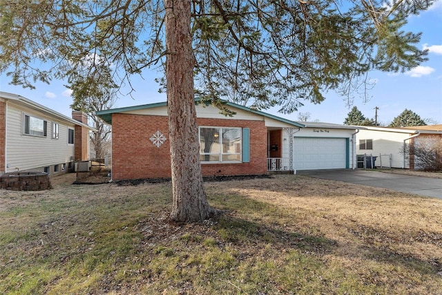 single story home featuring a garage and a front yard