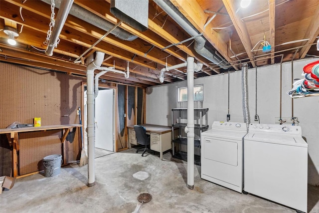 basement featuring separate washer and dryer and a workshop area