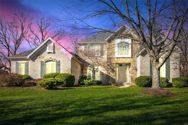 view of front of home featuring a yard