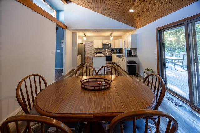 dining area with hardwood / wood-style floors, wood ceiling, and vaulted ceiling