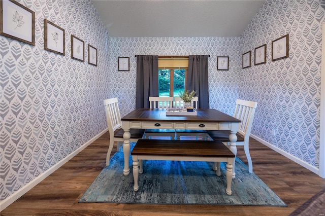 dining area featuring a textured ceiling and dark hardwood / wood-style floors