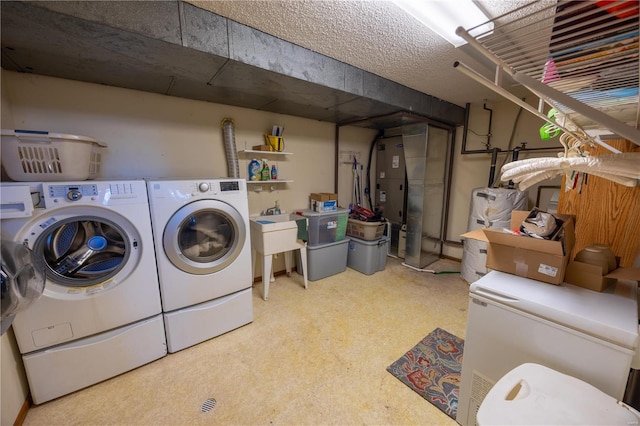 washroom with washer and dryer