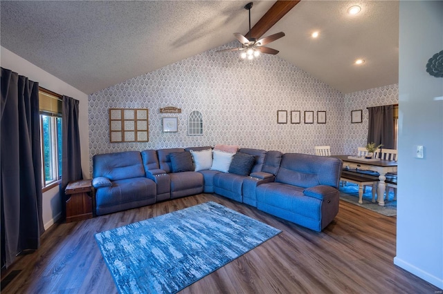 living room with lofted ceiling with beams, hardwood / wood-style flooring, and a textured ceiling