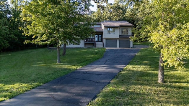 view of front of home featuring a garage and a front yard