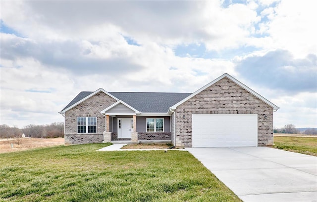 view of front of property with a garage and a front yard