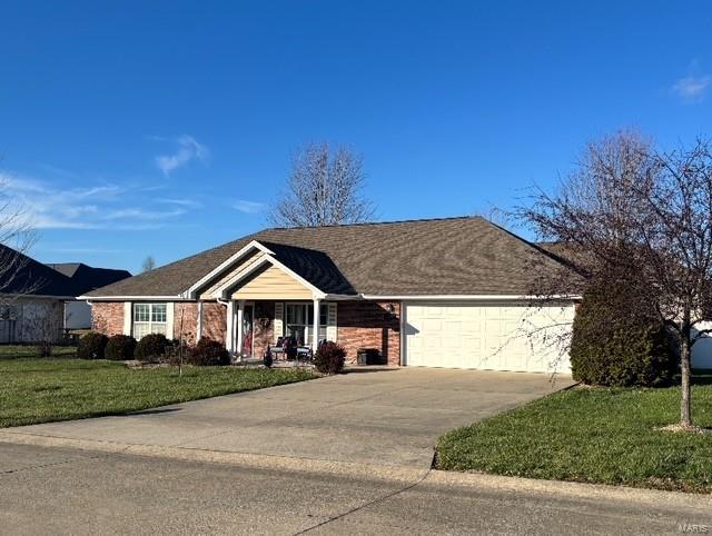 ranch-style house with a front lawn and a garage