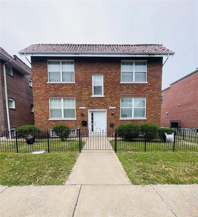 view of front of home featuring a front yard