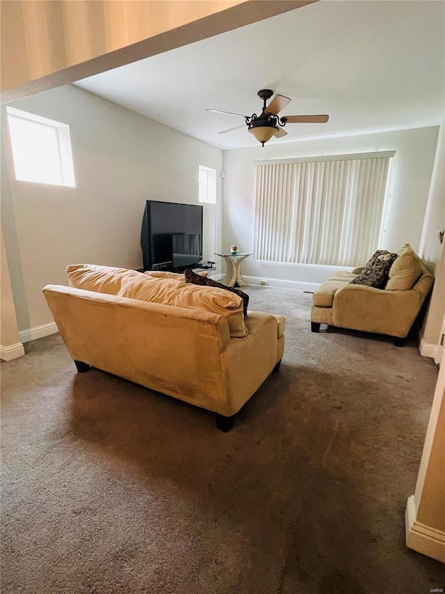 carpeted living room featuring ceiling fan and plenty of natural light