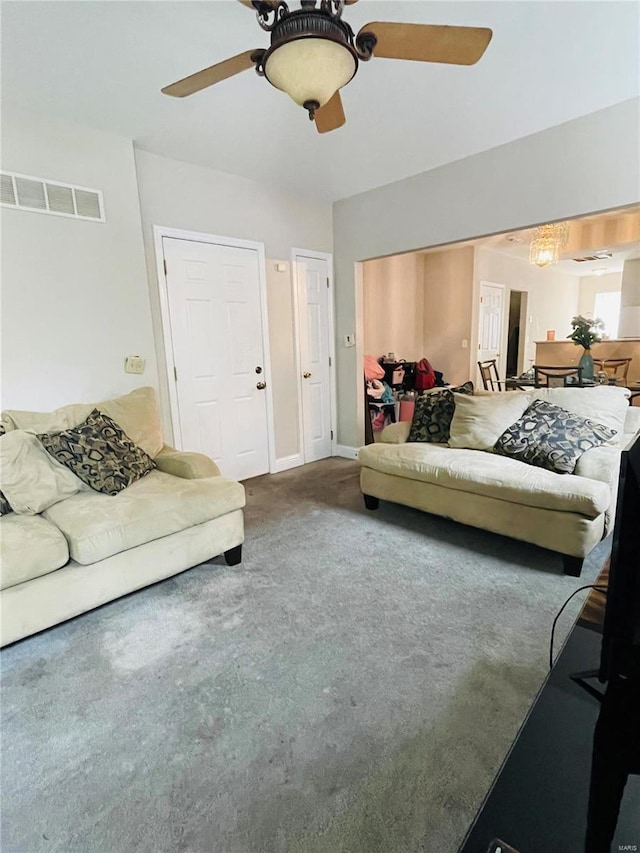 living room with carpet and ceiling fan