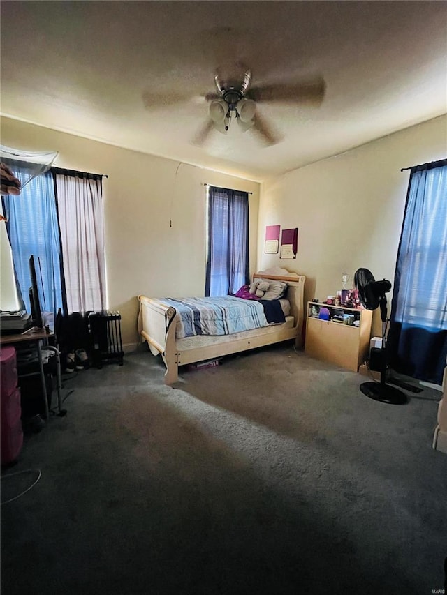 carpeted bedroom featuring ceiling fan