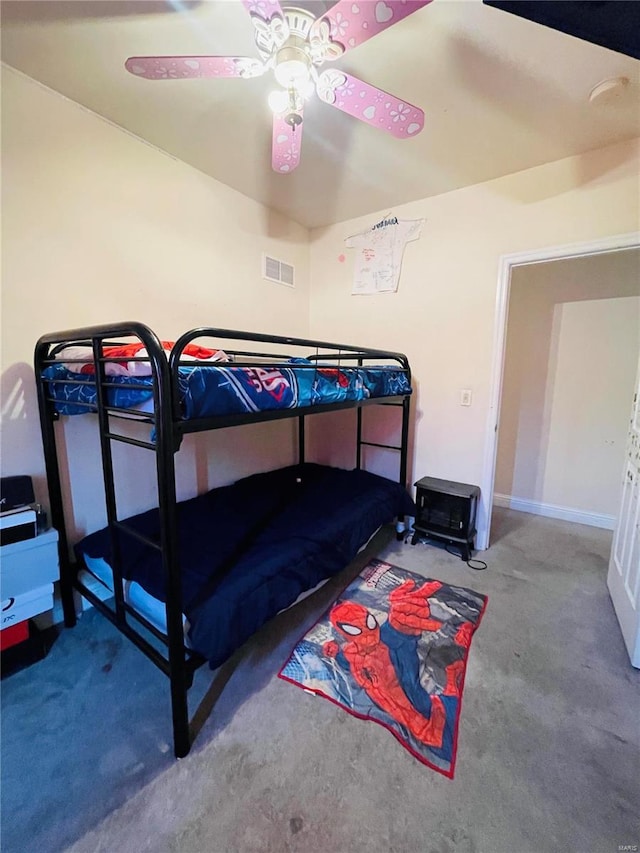 bedroom with ceiling fan and carpet