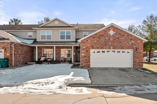 view of front property featuring a garage and covered porch