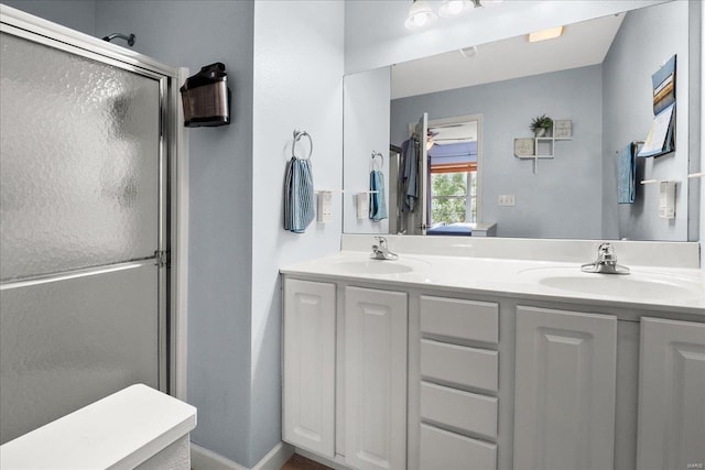 bathroom featuring walk in shower and vanity